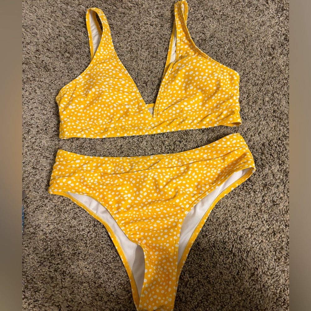 Women’s bikini. Yellow with white polka dots.